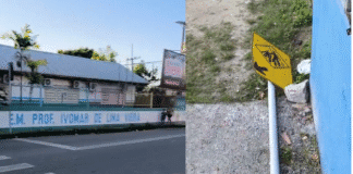 Placa caída em frente à escola coloca crianças em risco Placa de Trânsito