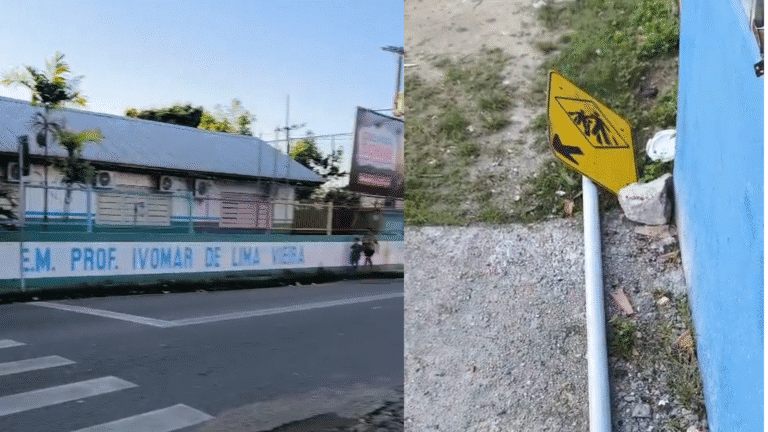 Placa caída em frente à escola coloca crianças em risco